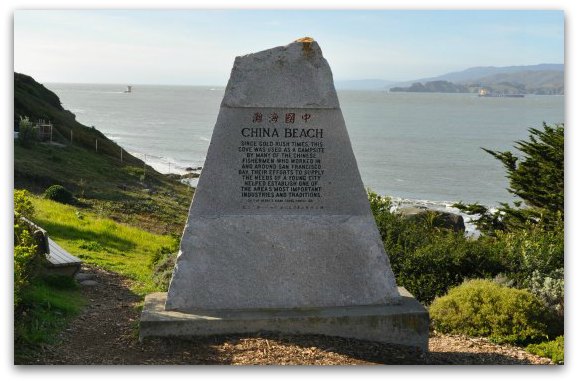 The rock sign at China Beach in San Francisco that discusses its history.